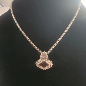 Elegant Gold and Silver Pendant Necklace